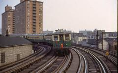 Chicago CTA North Side L train near North Ave and Halsted with Flannery Apartments in the background