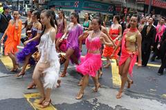 People in Hawaii traditional outfits dancing on the street during the Handover Parade