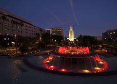 Grand Park fountain lit in Belgian flag colors at night