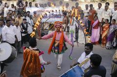 A man dancing with fire at Pongal Festival in Namakkal, Tamil Nadu