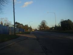 Bath Road in Taplow on a sunny day with cars and buildings along the road