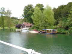 Boat House, Cliveden by the water with lush greenery