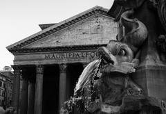 The Pantheon fountain splashing water with the Pantheon building in the background