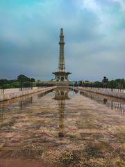 Minar-e-Pakistan under a blue sky with shadow