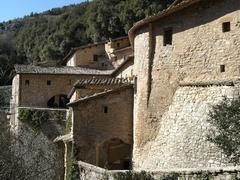 Eremo delle Carceri hermitage near Assisi surrounded by trees in spring