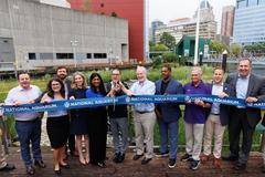 National Aquarium's Harbor Wetland outdoor exhibit at Baltimore Inner Harbor with community leaders at ribbon cutting