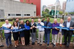 Baltimore County Executive Olszewski and officials at National Aquarium Harbor Wetland ribbon cutting