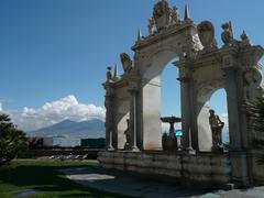 Fontana del Gigante in Naples with Mount Vesuvius partially snow-covered in the background