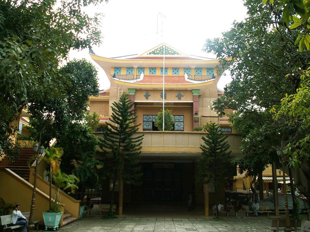 Main hall of Xa Loi Pagoda with intricate architectural details and statues