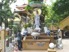Chinese style statue of bodhisattva Quan Am in Xa Loi Pagoda courtyard Ho Chi Minh City