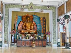 Main hallway of Xa Loi Pagoda with large Gautama Buddha statue in Ho Chi Minh City
