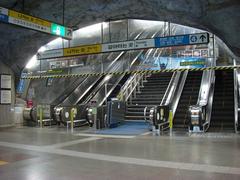 Chungmuro Station subway entrance in Seoul with city buildings in background
