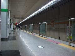 Yaksu Station platform with passengers and train
