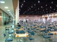 Bridge tournament playing area with tables and players at Gatlinburg Tennessee convention center in April 2002