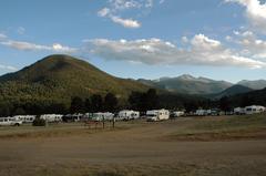 Elk Meadow Lodge and RV Resort at sundown with mountains in background Estes Park