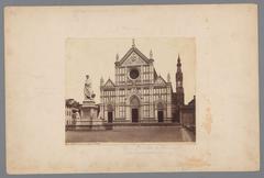Santa Croce church exterior with a statue of Dante Alighieri in front, Florence, Italy