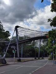 Intricate cable net construction of Lodzer Steg bridge in Stuttgart