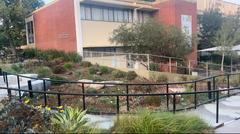 Garden with seating area behind Career Center building at Cal State LA