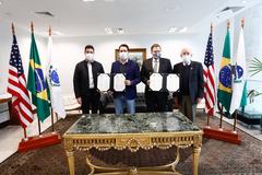 Governor of Paraná Carlos Massa Ratinho Junior and US Ambassador Todd Chapman signing mutual cooperation agreement