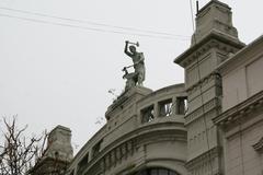 Statue of a forger on building facade at Calle Perú San Telmo Buenos Aires