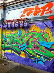 Colorful graffiti art on Haight and Ashbury street wall in San Francisco
