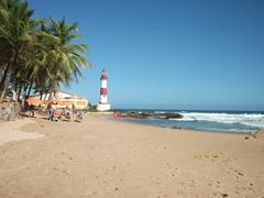 Lighthouse at Ponta de Itapuã in Salvador da Bahia, Brazil during sunset