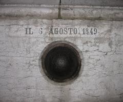 Exterior view of Chiesa di San Salvador church in Venice with historical bullet mark