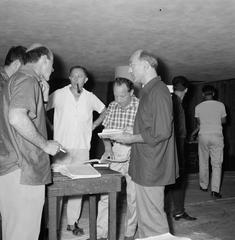 Black and white photo of actors rehearsing the play Galileo by Bertolt Brecht with director Sam Besekon in Israel in 1964