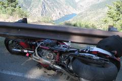 Mangled motorcycle beneath guard rail after crash caused by intoxicated operator, featuring a safety safety brief at Marine Corps Air Station Miramar