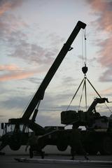 US Marines unloading equipment to recover an emergency landed F/A-18D Hornet at Combat Center expeditionary airfield
