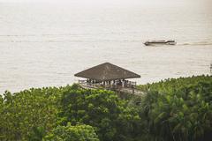 View of Mangal das Garças park in Belem, Para with lush greenery and a traditional building