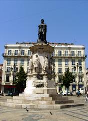 Statue of Luís de Camões at Luís de Camões Square in Bairro Alto, Lisbon with the Brazilian Consulate building in the background
