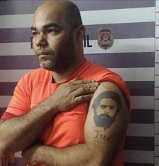 Prison inmate sitting in a jail cell