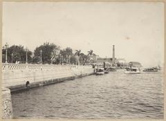 Old dock with boats and wooden structures on calm water