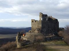 Castle Hollókő in Hungary overlooking the surrounding landscape from a nearby hill