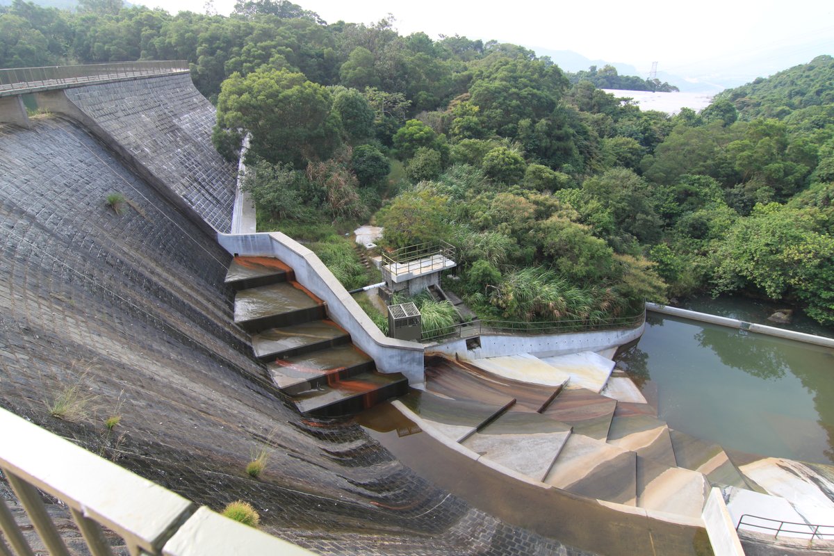 Dam of Ho Pui Reservoir in Hong Kong surrounded by lush greenery