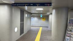 Osaka Metro Dobutsuen-mae Station entrance number 3 with people walking and yellow taxis