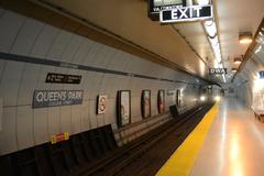 Interior view of Queen's Park Subway Station with escalators and modern lighting