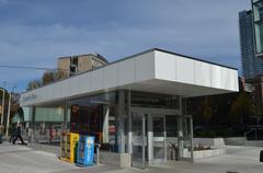 Queen's Park Subway Station platform with tracks and people