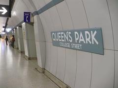 Interior view of Queen's Park TTC subway station with distinctive curved tile walls in Toronto