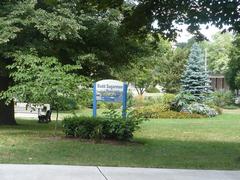 Budd Sugarman Park beside Rosedale subway station in Toronto with green spaces and trees