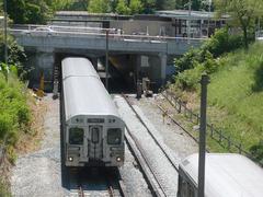 Two Toronto subway trains meeting at Rosedale station on a curved track