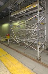Scaffolding set on TTC streetcar rails with small wheels, Spadina TTC