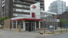 Walmer entrance to Spadina subway station in Toronto with stairs and a green awning