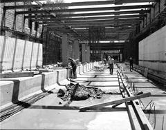 Excavation site near Wellesley subway station in Toronto with construction equipment and urban surroundings