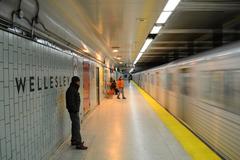 Interior view of Wellesley Subway Station with arched ceiling and benches