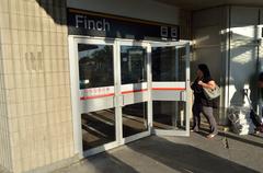 Finch TTC subway station platform with staircases and signage