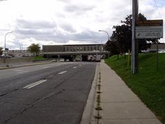 View of Allen Road and Wilson station spanning Wilson Avenue with Asian long-horned beetle infestation sign in Toronto