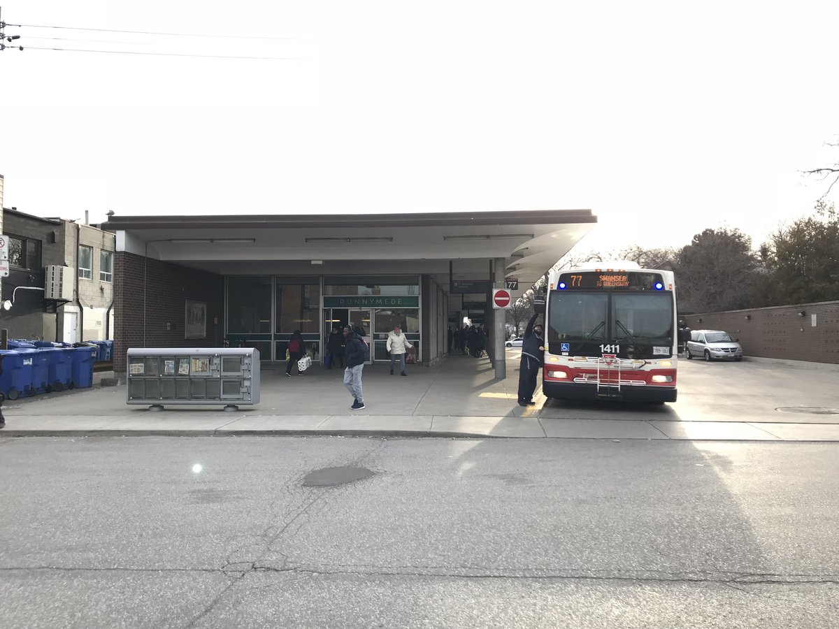 Kennedy Street Entrance to Runnymede Subway Station with TTC Bus 1411 at the station showing route 77 Swansea to Queensway sign