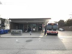 Kennedy Street Entrance to Runnymede Subway Station with TTC Bus 1411 at the station showing route 77 Swansea to Queensway sign